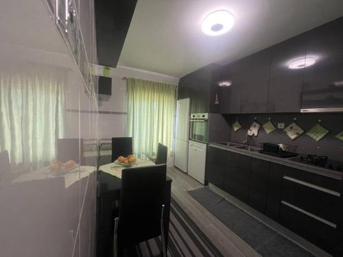 Cucina o angolo cottura di Apartamento com 1 quarto para casais ou amigos a 20 min de Lisboa