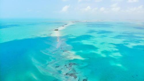 an aerial view of an island in the ocean at Casa Paraiso Punta Allen in Punta Allen