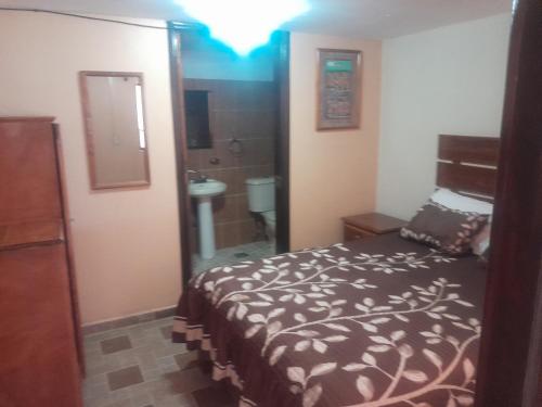Postel nebo postele na pokoji v ubytování Hotel Casa Amelia