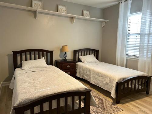 a bedroom with two beds and a window at Cozy 3BR Home Peaceful Vibes Centrally Located in Martinez