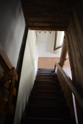 a staircase leading up to a room with a stair case at Carü Leufu in Valle Grande