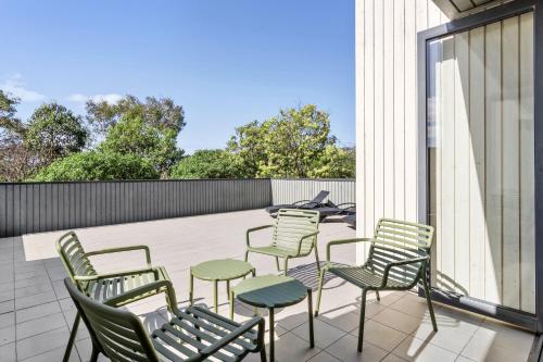 a group of chairs sitting on a patio at Quarters at Flinders Hotel in Flinders