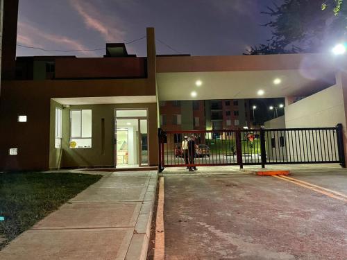 a person standing in front of a building at apulo jacana del lago in Apulo