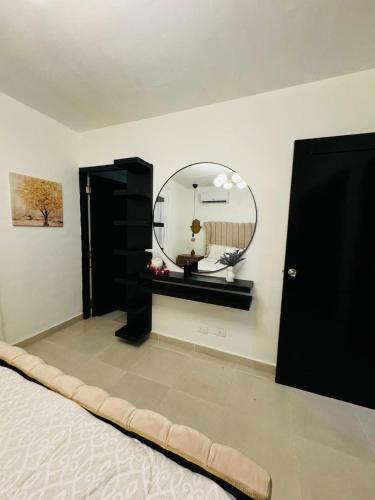a room with a mirror on the wall and a bed at Luxurious and comfortable 1 level in Juan López