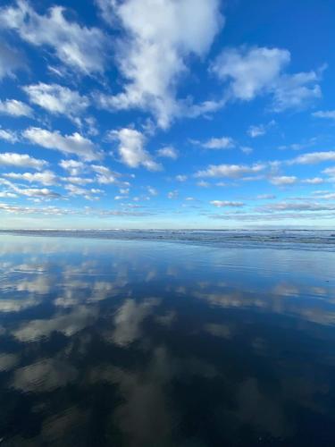 a view of the water with clouds in the sky at Tidal House #10 - Ocean Shores Chalet in Ocean Shores