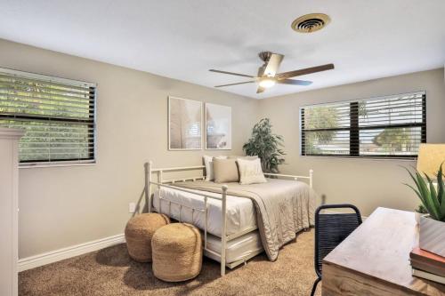 a bedroom with a bed and a ceiling fan at Kiss The Wave - Spacious 4br3ba, Wpoolhot Tub in Indian Harbour Beach