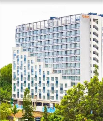 a large white building with a sony hotel at ONeal Prime Suites - Furnished Studio apartments in Nairobi Near JKIA & SGR in Nairobi