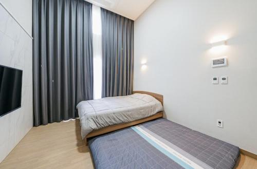 Katil atau katil-katil dalam bilik di New Jeju House