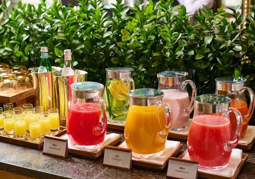 a display of different types of juices in glass jars at Park Hyatt Shanghai in Shanghai