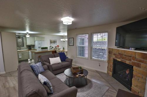 a living room with a couch and a fireplace at Peaceful Retreat in the Heart of Missoula in Missoula