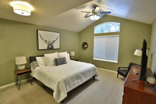 a bedroom with a bed and a ceiling fan at Peaceful Retreat in the Heart of Missoula in Missoula