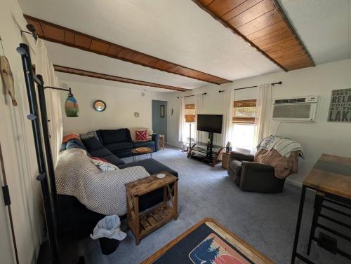 a living room with a couch and a table at Port Clinton Lakeside Escape in Port Clinton
