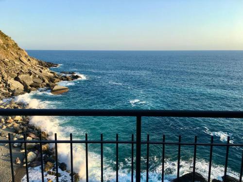 a view of the ocean from a cliff at Carattino 12 Idyllic Seafront Retreat in Vernazza