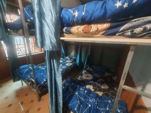 a group of bunk beds in a room at GoHaGiang in Ha Giang