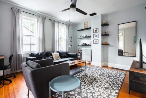 a living room with a couch and a table at Historic Comfy German Village Haus sleeps6petsOK in Columbus