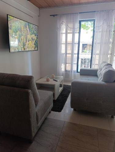 a living room with a couch and a table at Apartamento comodo in Cali