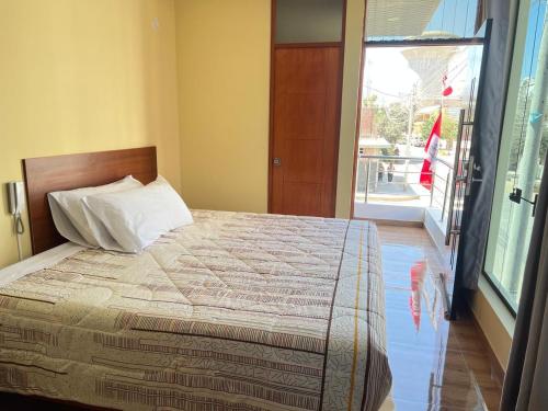 Ένα ή περισσότερα κρεβάτια σε δωμάτιο στο HOTEL SAMANAHUASi