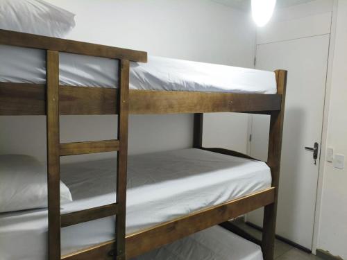 a couple of bunk beds in a room at Aconchegante apto na Z Oeste in Sao Paulo