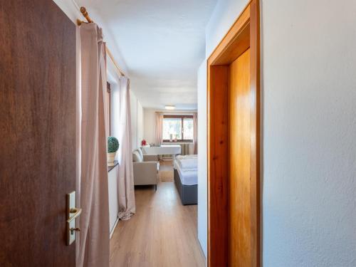 an open door to a room with a living room at Idyllic apartment in Sibratsgfäll in Sibratsgfäll