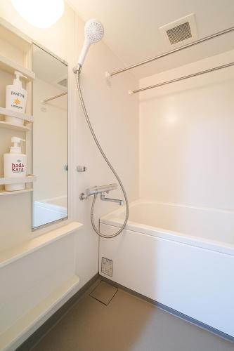 a shower in a bathroom with a shower head at willcourt in Tokyo