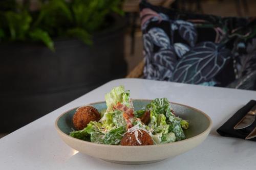 a salad in a bowl on a table at The Clements Hotel in Cambridge