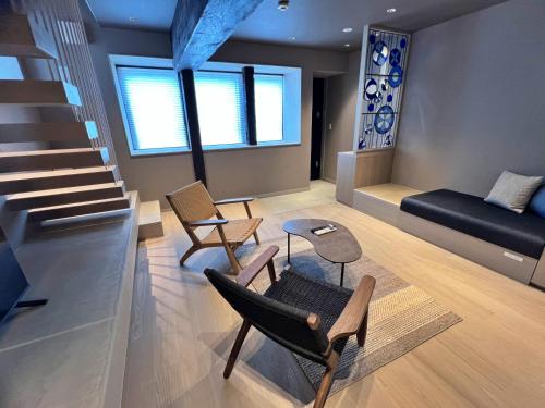 a living room with two chairs and a couch at The 曜 Terrace in Hirado