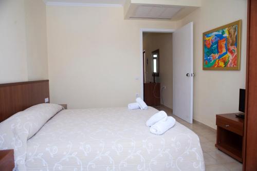 Postel nebo postele na pokoji v ubytování Summertime Inn