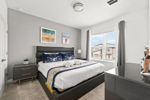 a bedroom with a large bed and a window at 390 Strand Drive in Melbourne Beach