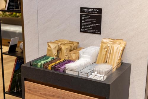 a display case in a store filled with lots of products at Tokyu Stay Yoga in Tokyo