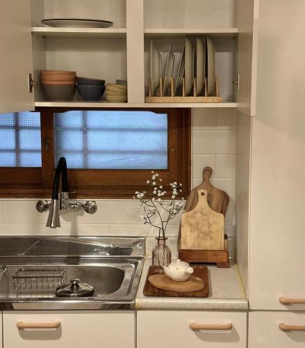 a kitchen with a sink and a counter top at Hayoungs House in Seoul