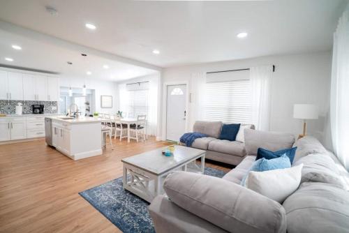 a living room with a couch and a table at Beautiful Spacious Stylish near Busch Gardens in Tampa