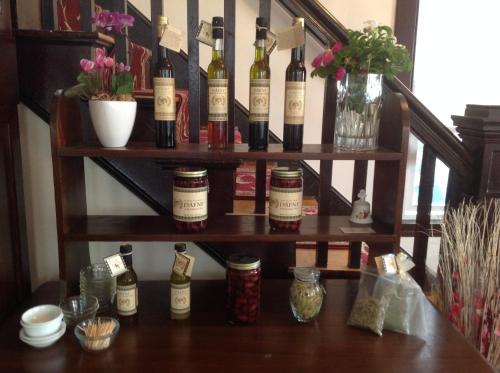 a bunch of bottles of wine on a shelf at The Rebekah Inn in Old Orchard Beach