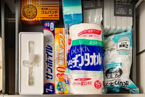 a drawer filled with toothbrushes toothpaste and toilet paper at Ｊ Studio Oarai in Hokota
