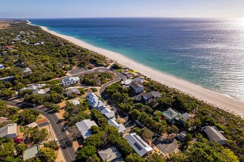 an aerial view of a beach with houses and the ocean at Yarrimbah Relaxed Coastal Getaway in Capel
