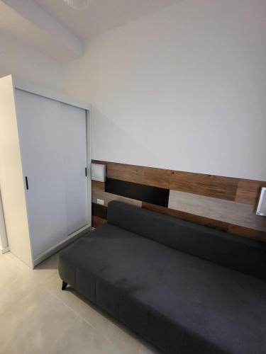 a bedroom with a bed and a white door at Apartament Centrum in Gdynia