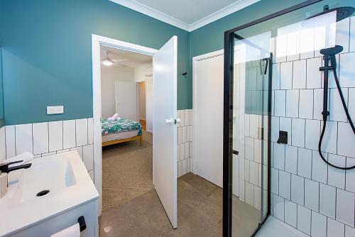 a bathroom with a shower and a sink at Yarrimbah Relaxed Coastal Getaway in Capel