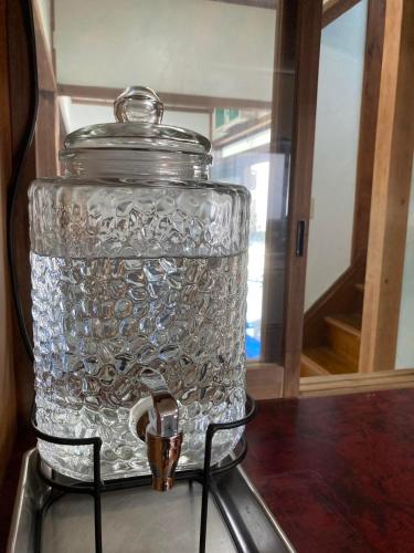a glass jar sitting on top of a table at Yado KONAMI in Shimoda