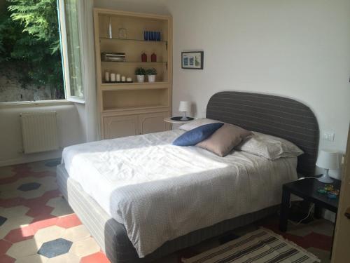 a bedroom with a large bed with a window at Casa di Marisa in Chieti