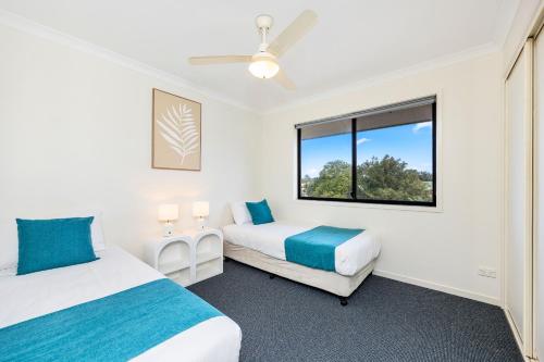 Ένα ή περισσότερα κρεβάτια σε δωμάτιο στο Arlia Sands Apartments