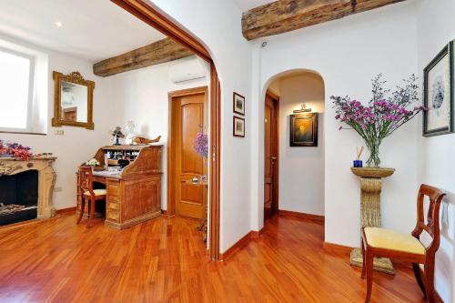 a living room with wooden floors and a fireplace at Terrazze Navona in Rome