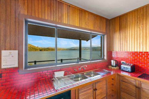 a kitchen with a sink and a large window at Bonnie Dawn - Bonnie Doon in Bonnie Doon