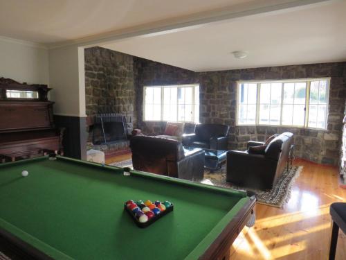 a living room with a pool table in it at Bluestones in Merrijig
