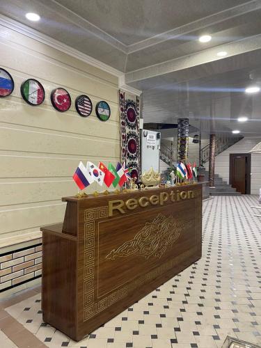 a store with a reception desk in a mall at Kifoyat Hotel in Samarkand
