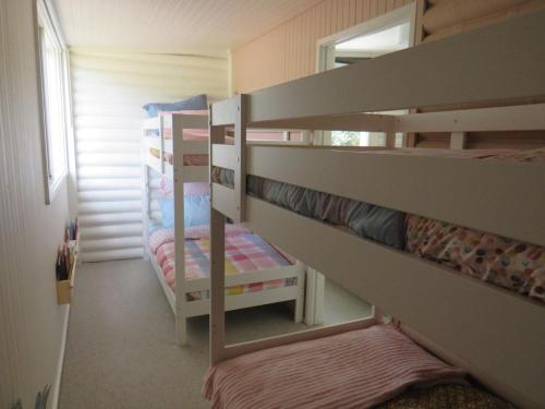 a room with two bunk beds in a room at Changue Buller Views in Merrijig