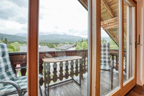 a balcony with a view of the mountains at Gästehaus Alpina in Krün
