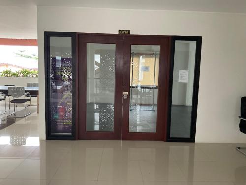a pair of glass doors in a building at Deluxe 2 Bedroom Condo Royal Oceancrest Mactan in Mactan Island