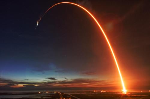 a rocket is flying through the sky with a trail at Cape Crossing 104 in Merritt Island