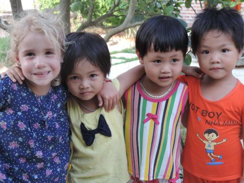 three young children standing next to each other at Ninh Binh Nature Homestay in Ninh Binh