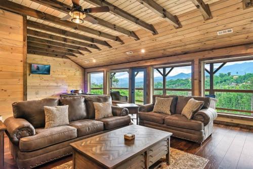 a living room with leather couches and a table at NEWLY BUILT Amazing View Chalet Perfect Location in Gatlinburg