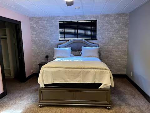 a bedroom with a large bed in a room at A Gorgeous Mansion for Jasper Vacation in Hinton